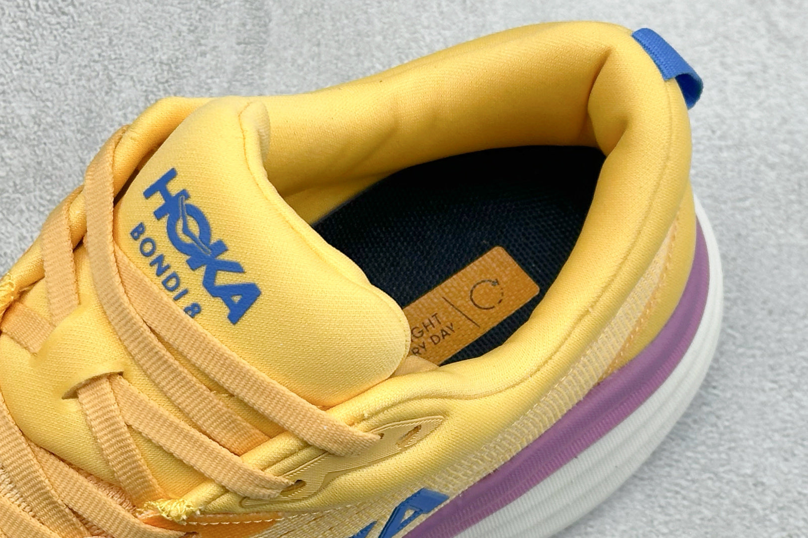 HOKA Bondi 8 Yellow Purple Gradient Blue Logo Running Shoes