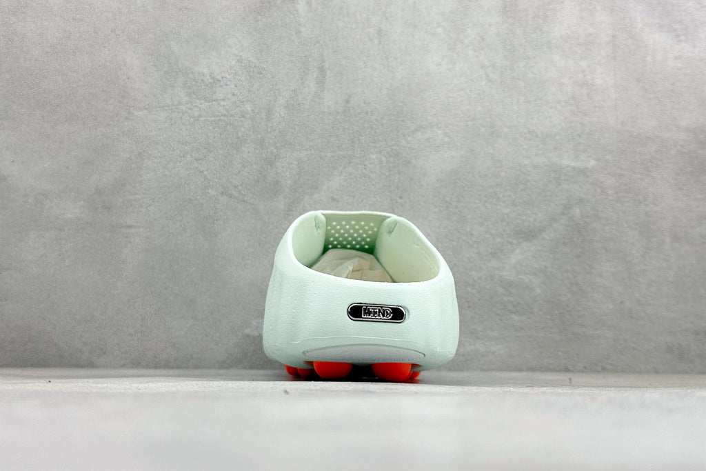 Nike Unisex "Neuro-Ball" Slide Sandal in Mint Green/Orange